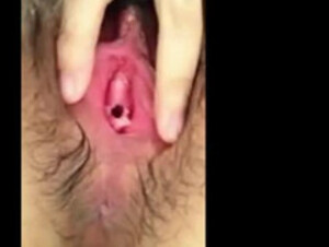 Asian teen masturbating her hairy pussy
