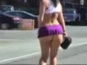 Sexy girl in short skirt on the street 