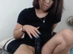 Young girl with black dildo