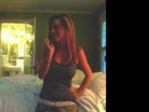 Busty girls talks to boyfriend on phone and strips